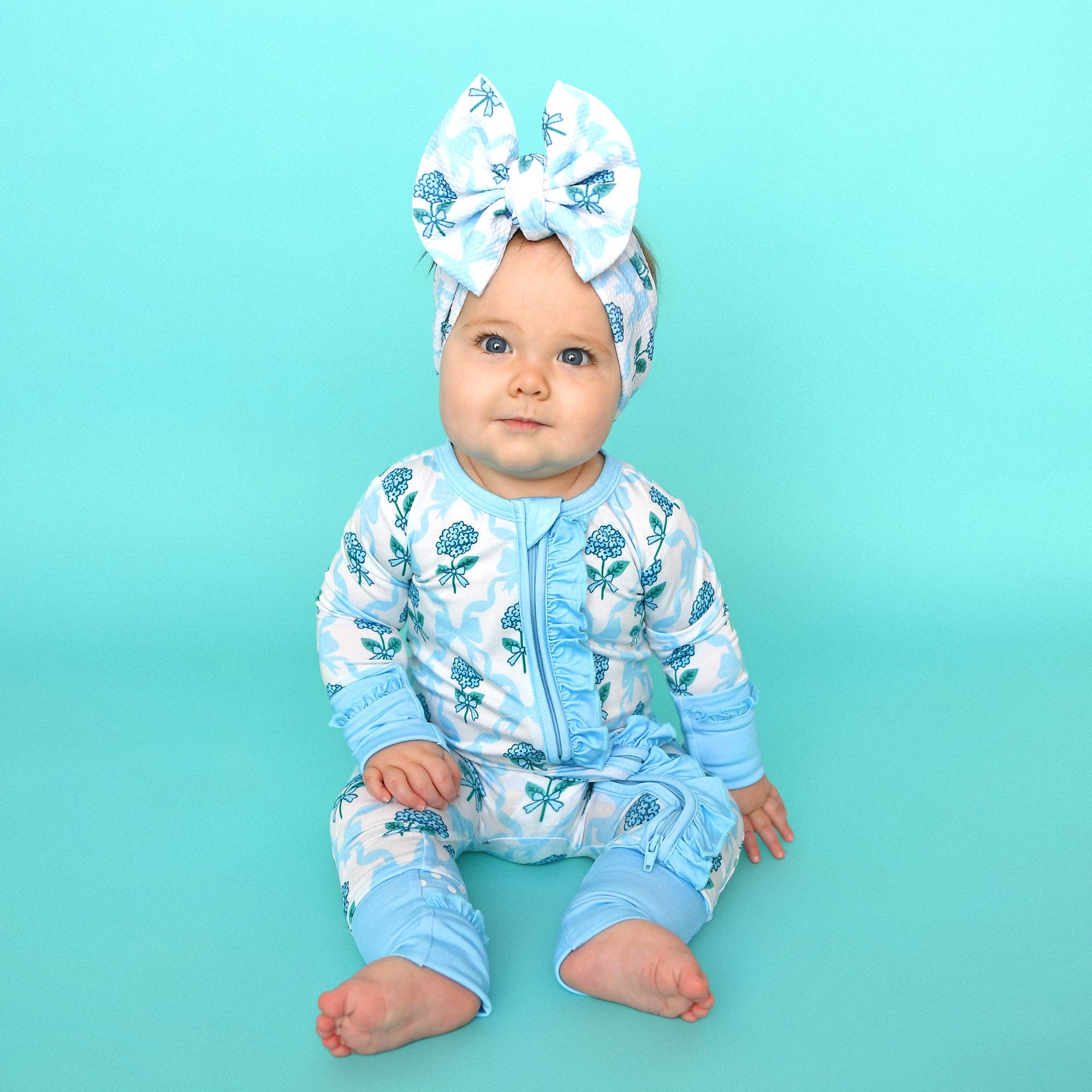 Bamboo Floral Ruffle Zip Sleeper — Baby One-Piece Outfit