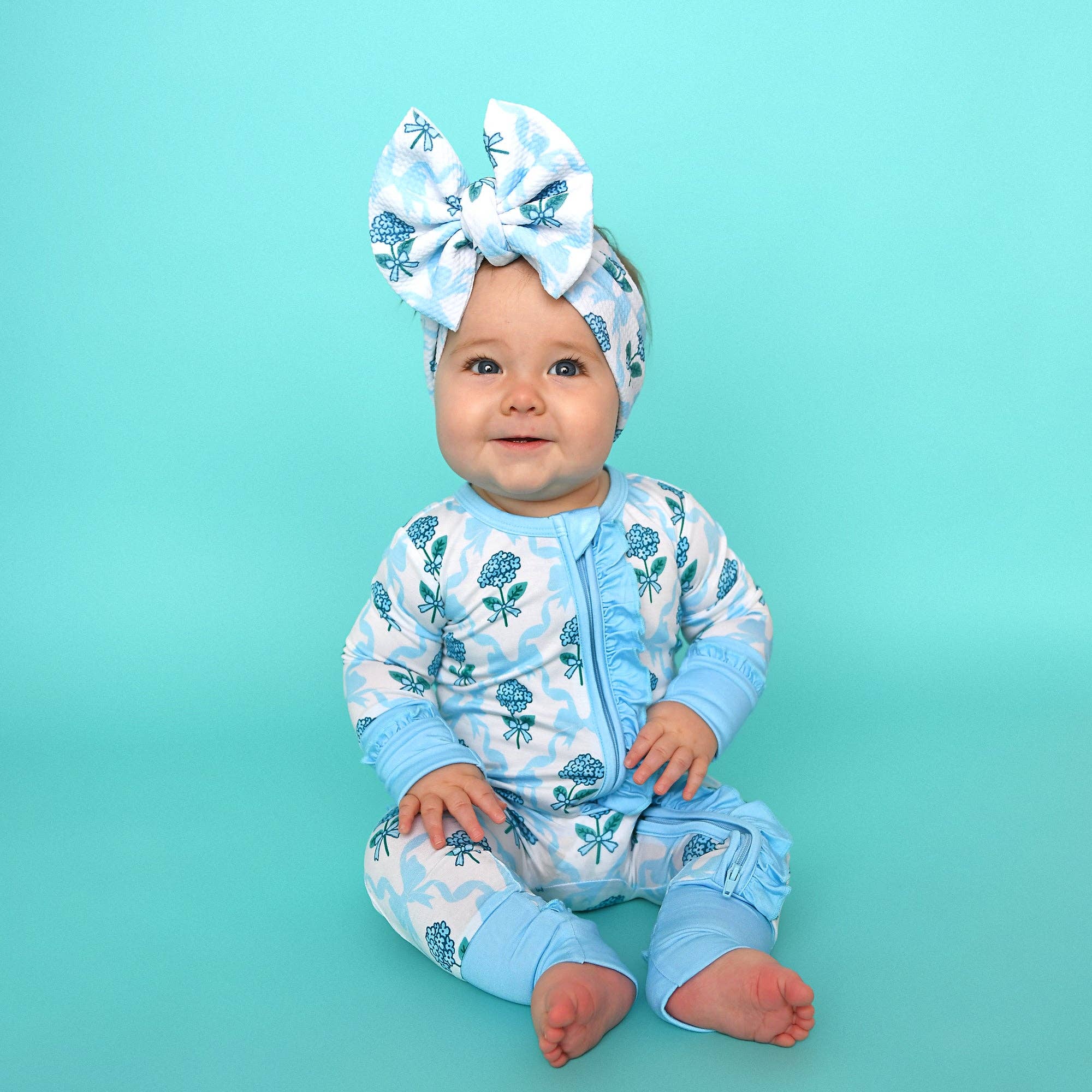 Bamboo Floral Ruffle Zip Sleeper — Baby One-Piece Outfit